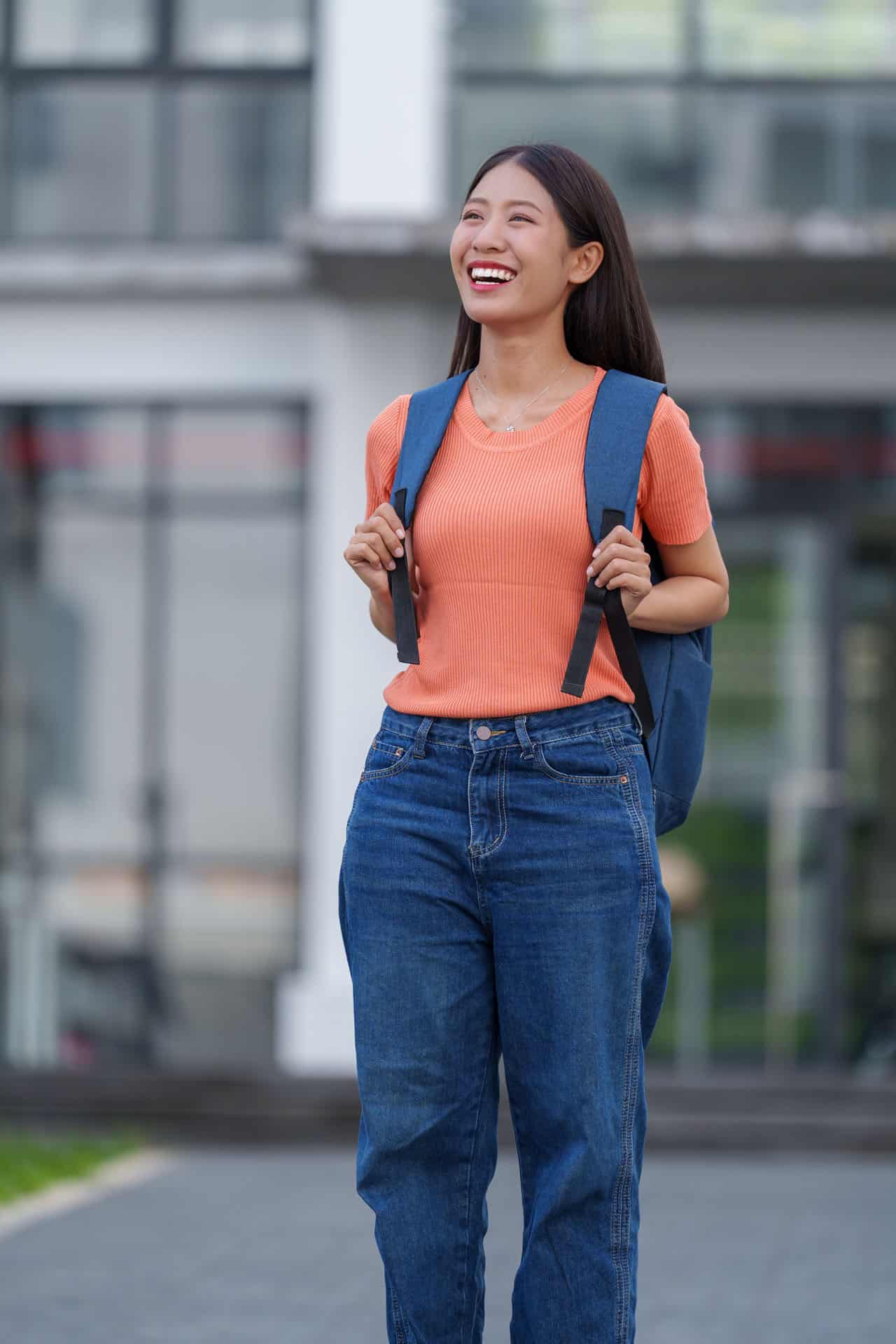 International student walking on campus after arriving in Australia to begin studies.