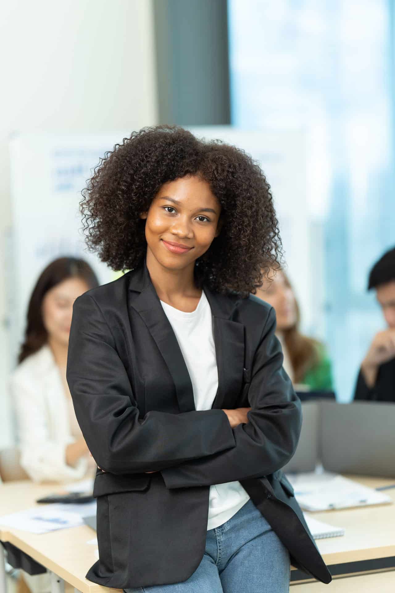 Confident student standing in a classroom during professional diploma training